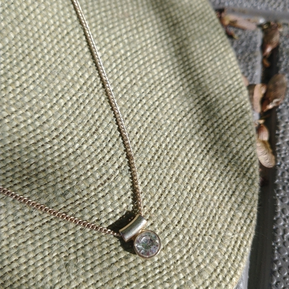 Women's gold tone rhinestone necklace.